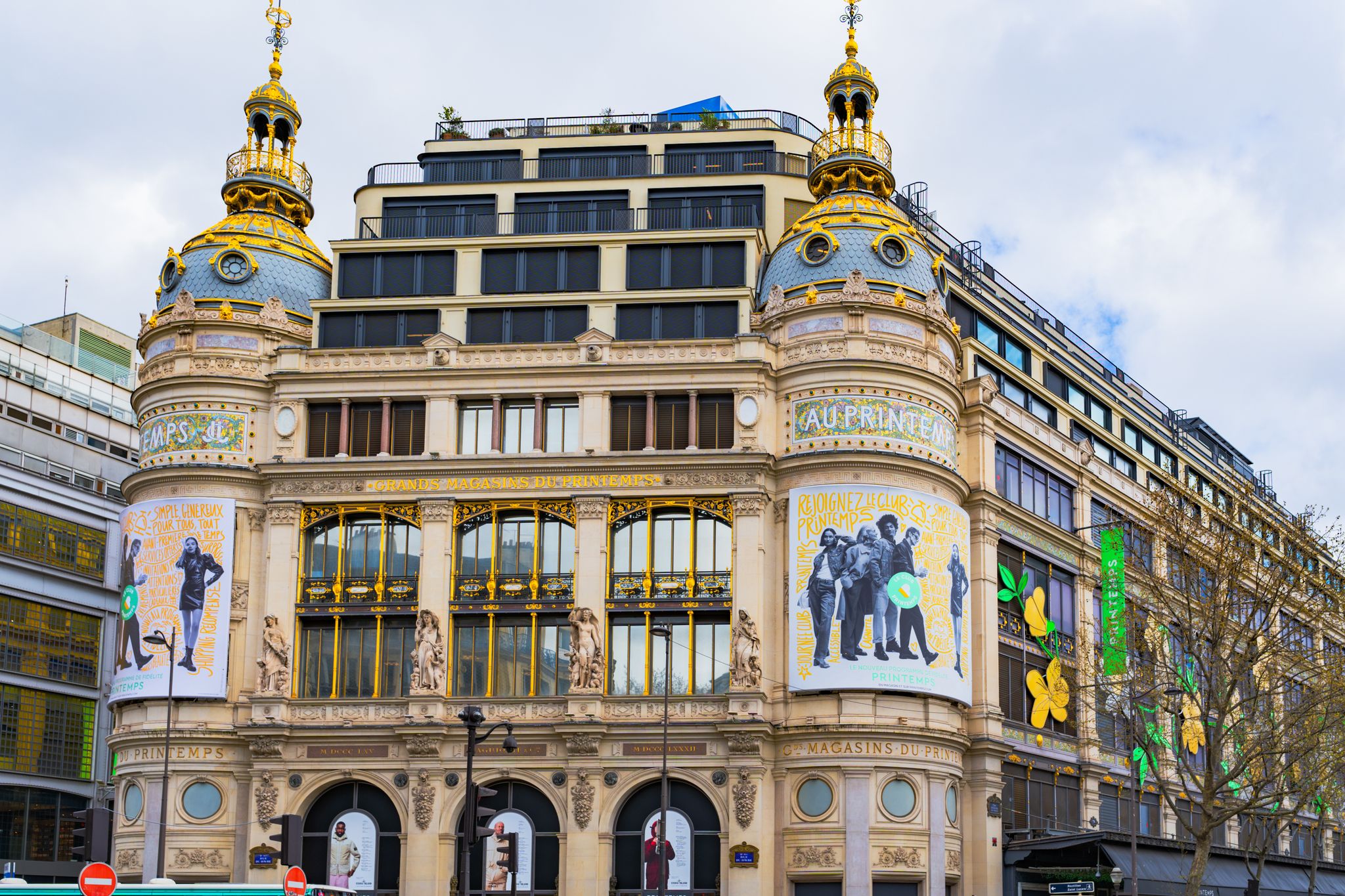 A vibrant view of the iconic Printemps department store in Paris showcasing its ornate architecture.